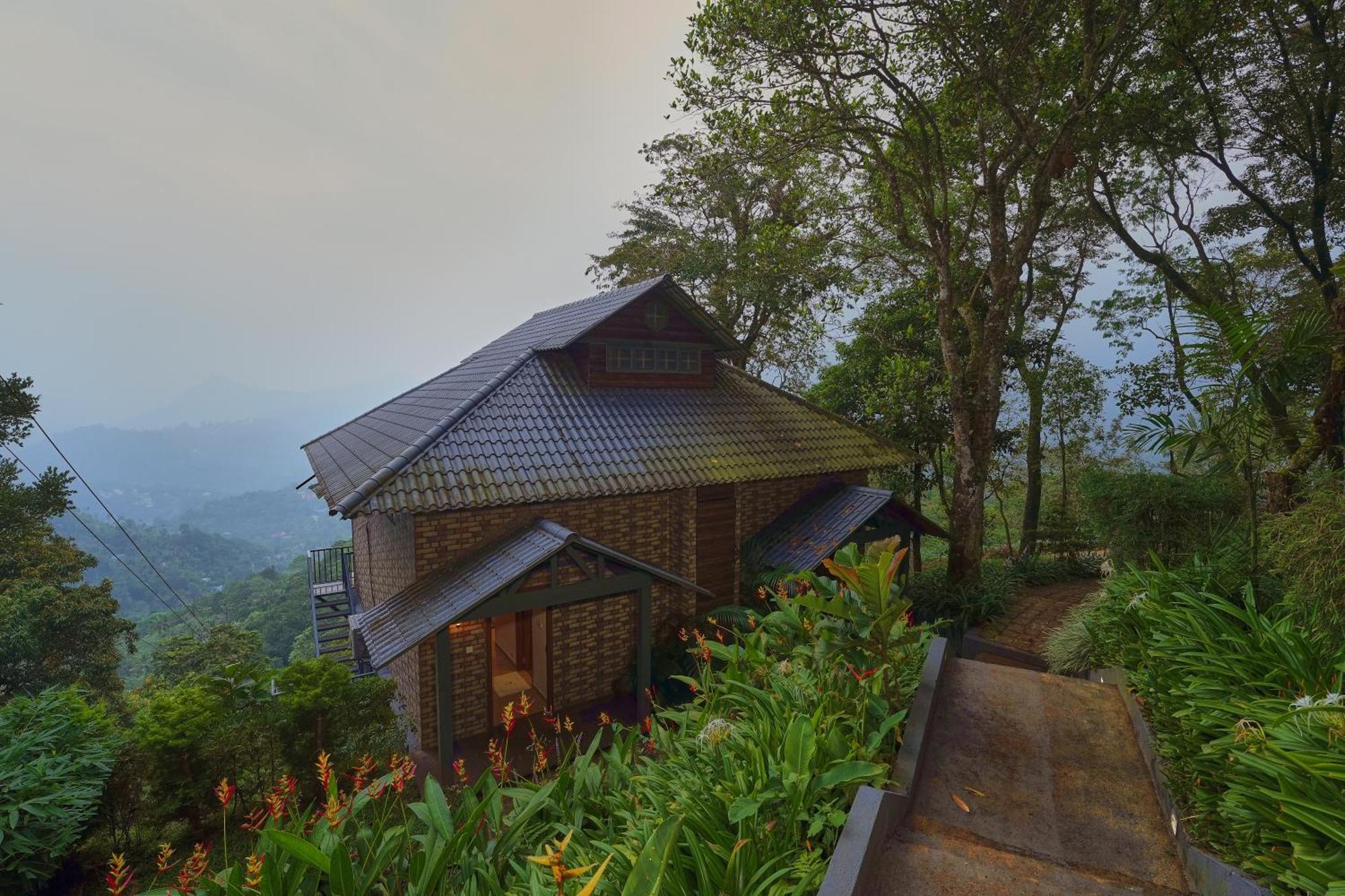 Elephant Passage Munnar Exterior foto A cottage at the resort